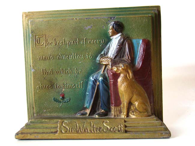 A pair of hand painted antique Bookends circa 1935 with a quote from Sir Walter Scott